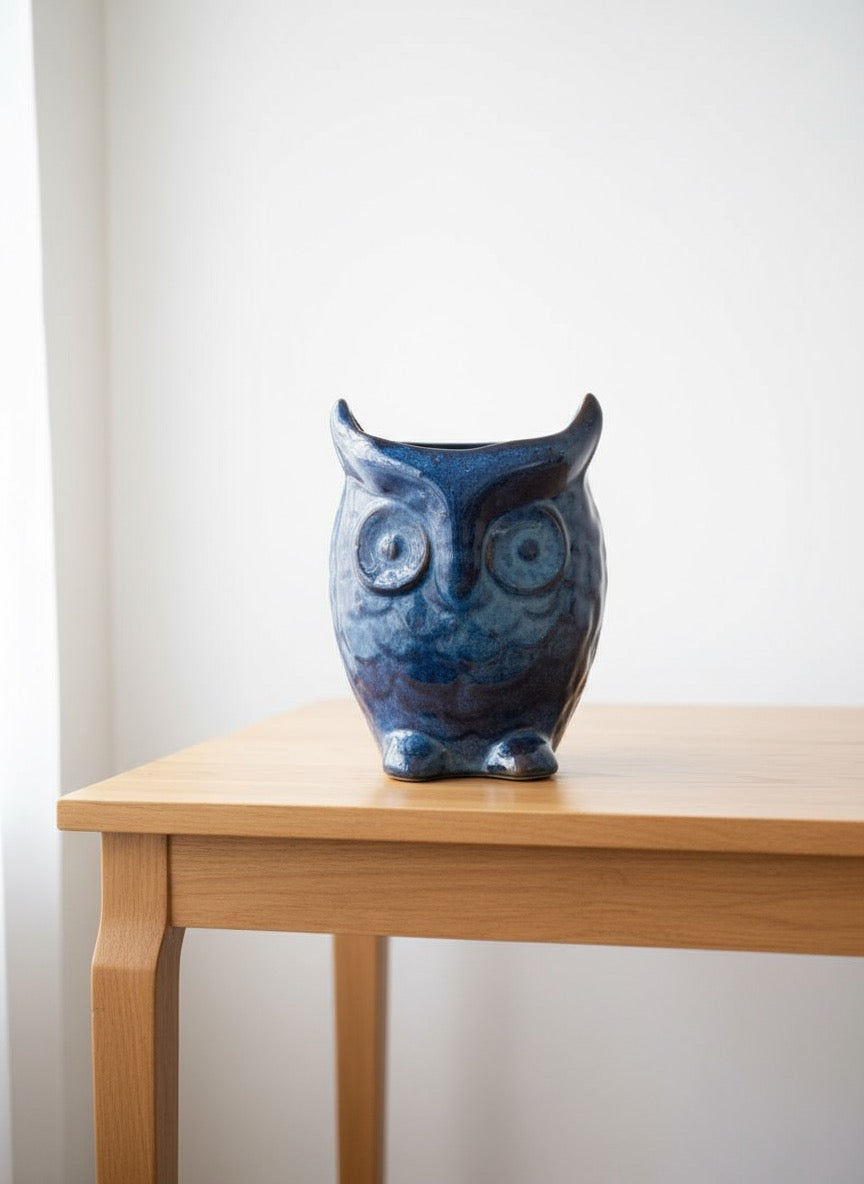 Cute ceramic owl shaped planter pot in deep blue reactive finish, perfect for succulents and small indoor plants.