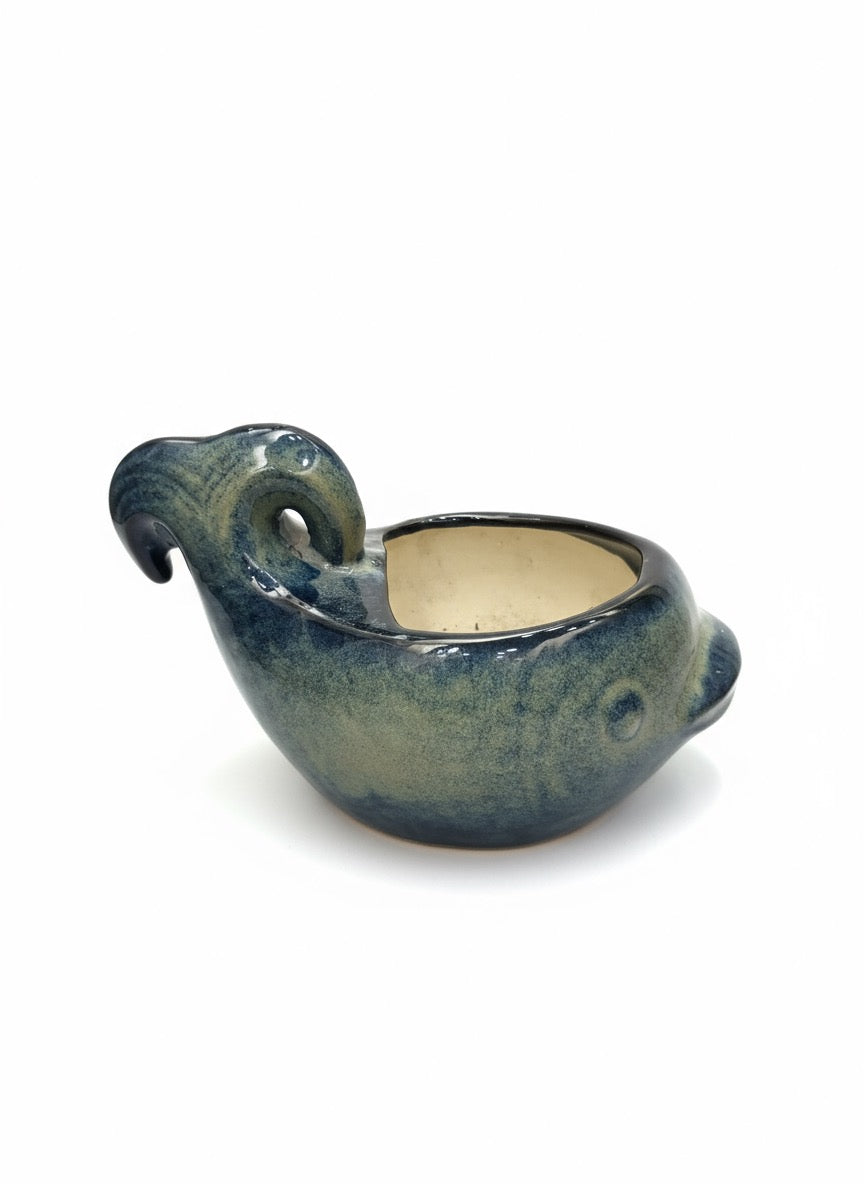 Artsy ceramic plant pot in aquatic fish design, perfect for succulents, herbs, and decorative foliage.