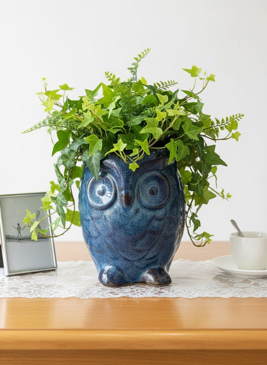 Blue reactive glaze owl planter with vibrant green ivy plant, ceramic decorative flower pot for indoor home decor.