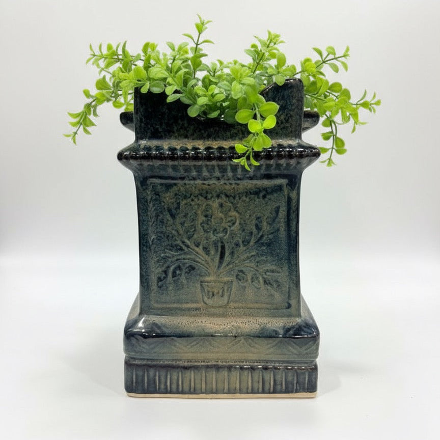 Ornate blue-green ceramic planter with floral motif, perfect for tulsi and other sacred plants.