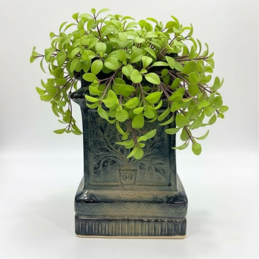 Handmade large ceramic planter for tulsi, featuring reactive glaze and embossed flower details.